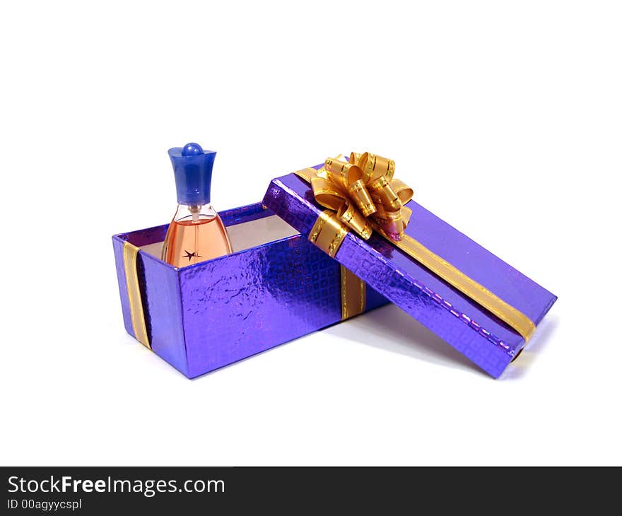 Bottle of perfume on congratulatory violet box over white background