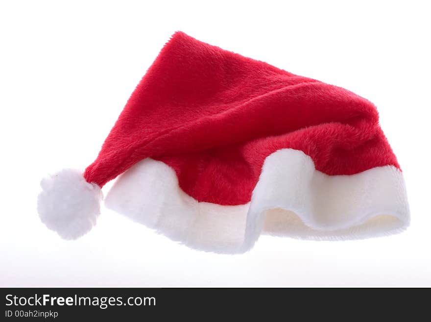 Saint nicks furry red holiday hat on white. Saint nicks furry red holiday hat on white