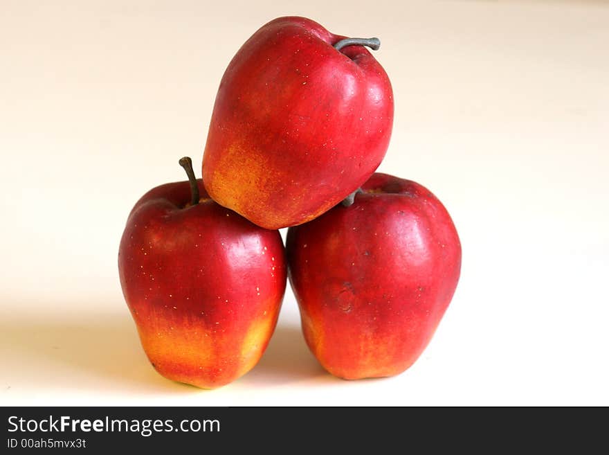 Apples stacked on a white background. Apples stacked on a white background
