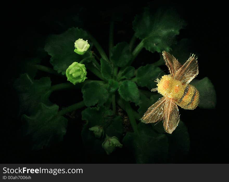 Artificial bumblebee above a flower of a violet