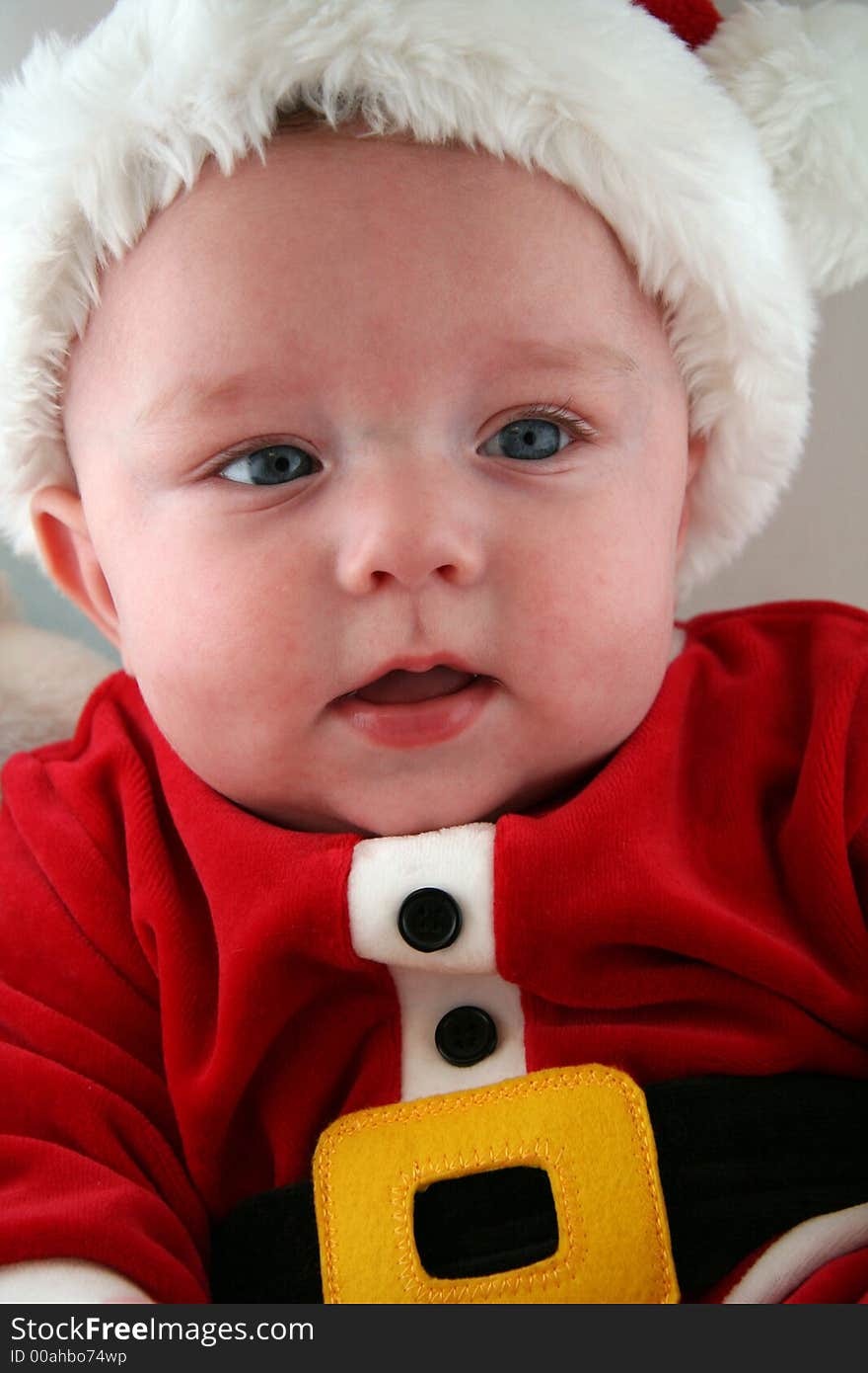 Baby Boy wearing a Santa Claus Outfit and Hat. Baby Boy wearing a Santa Claus Outfit and Hat