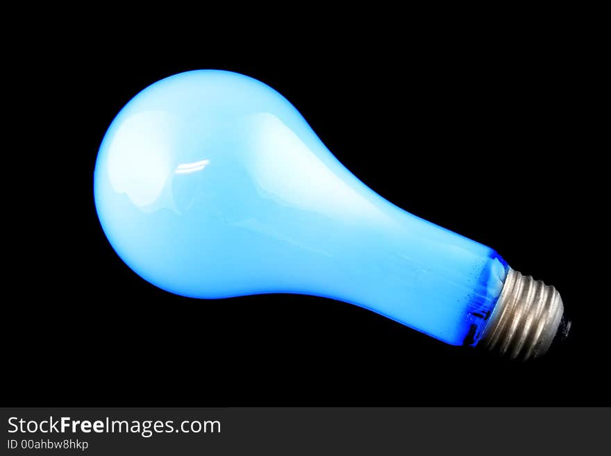 Bright Blue Light Bulb on Isolated Black Background