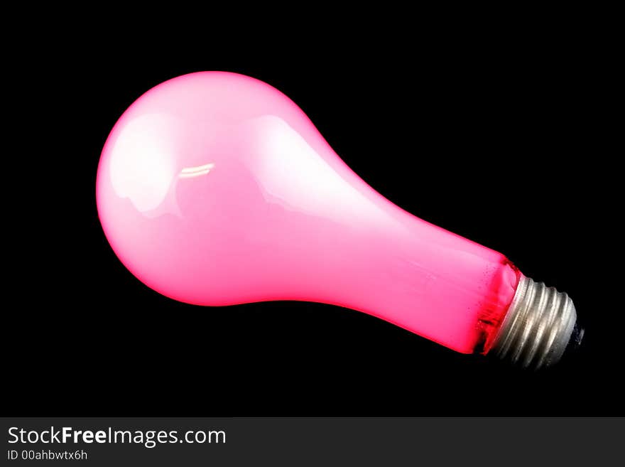 Bright Red Light Bulb on Isolated Black Background