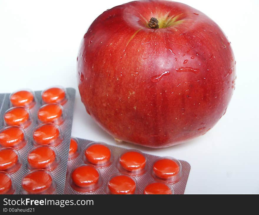 Red apple and red tablets. Red apple and red tablets