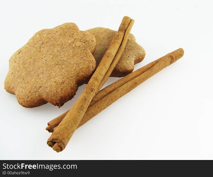 Gingerbreads and two sicks  of  cinnamon. Gingerbreads and two sicks  of  cinnamon