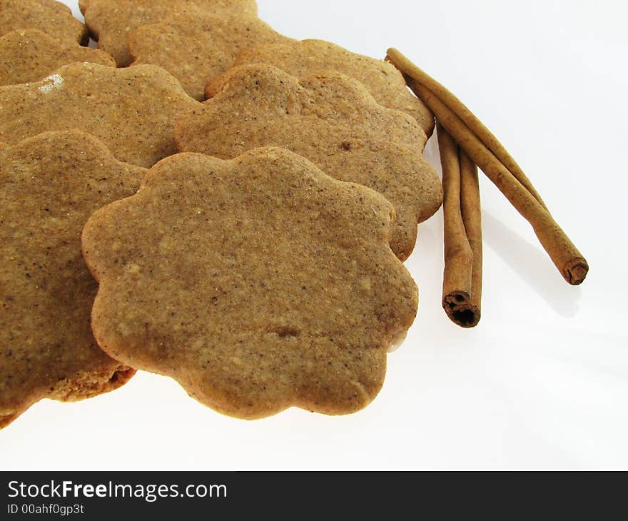 Gingerbreads and two sicks  of  cinnamon. Gingerbreads and two sicks  of  cinnamon