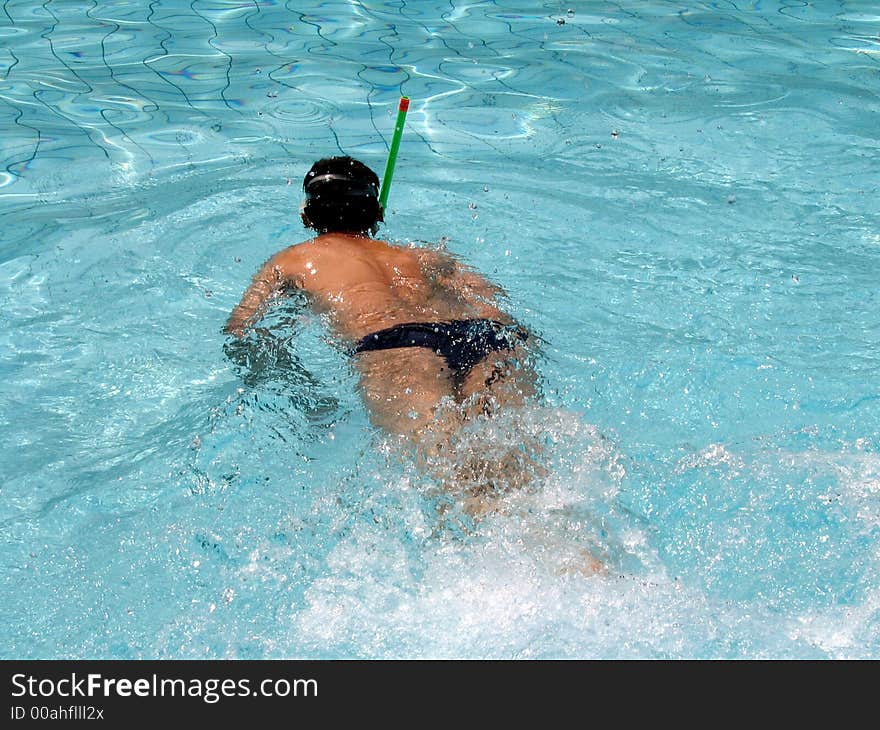 Action in water - Man swiming in pool