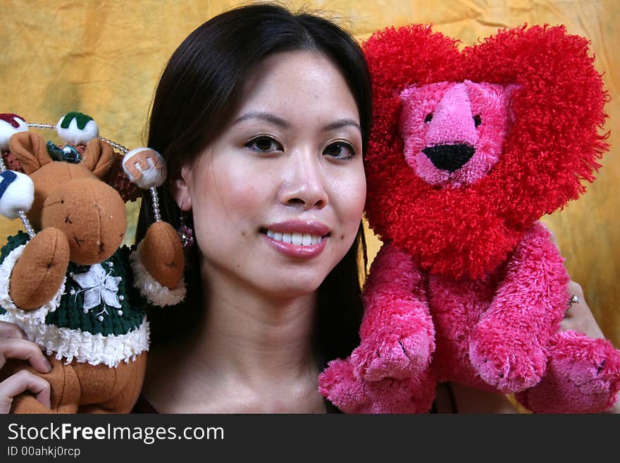 Asian girl and stuffed animals