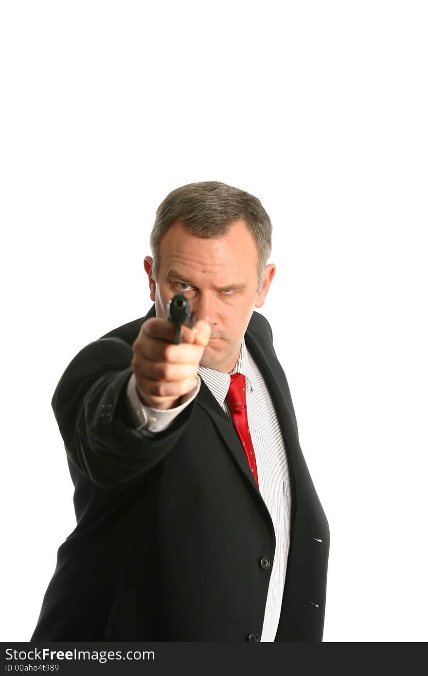 Businessman with suit and tie points handgun straight at camera isolated on white space. Businessman with suit and tie points handgun straight at camera isolated on white space