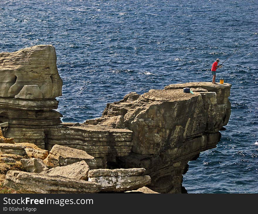 Near Peniche, Portugal, fishing from a high place. Near Peniche, Portugal, fishing from a high place