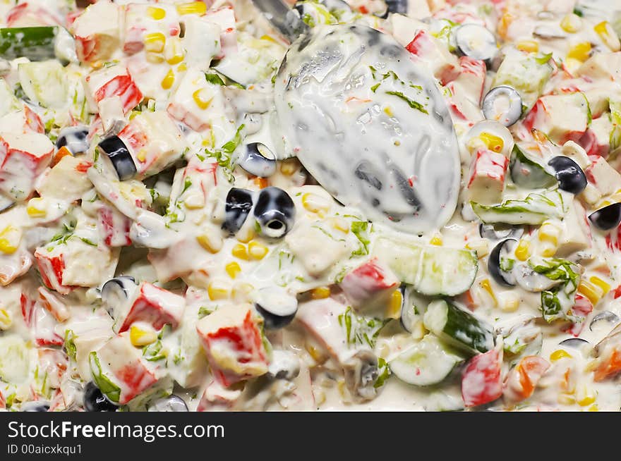 Mixed salad background with spoon