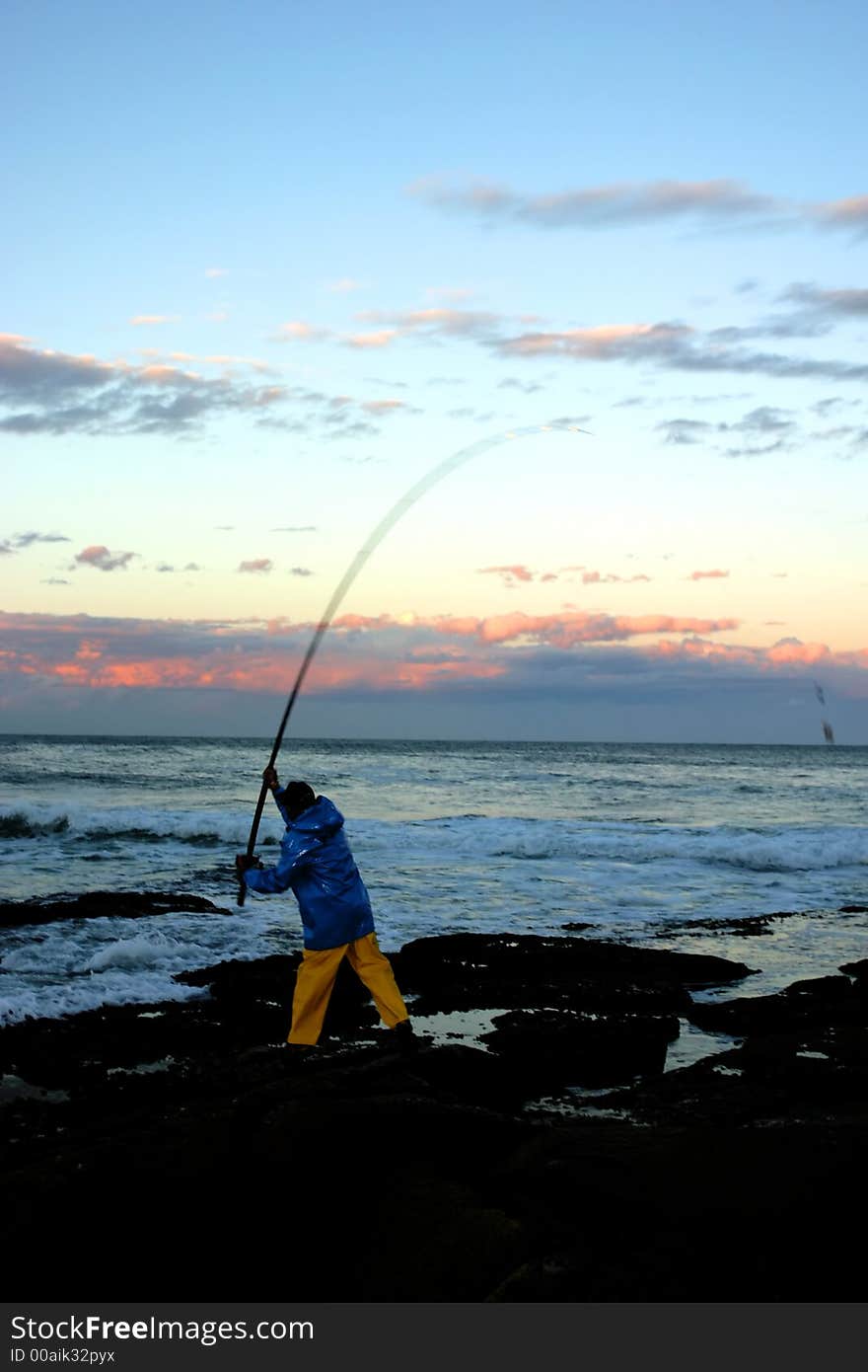 Fisherman casting his bait into the horizon. Fisherman casting his bait into the horizon