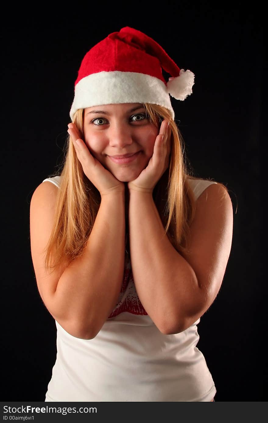 Surprised Christmas blonde girl, black background. Surprised Christmas blonde girl, black background