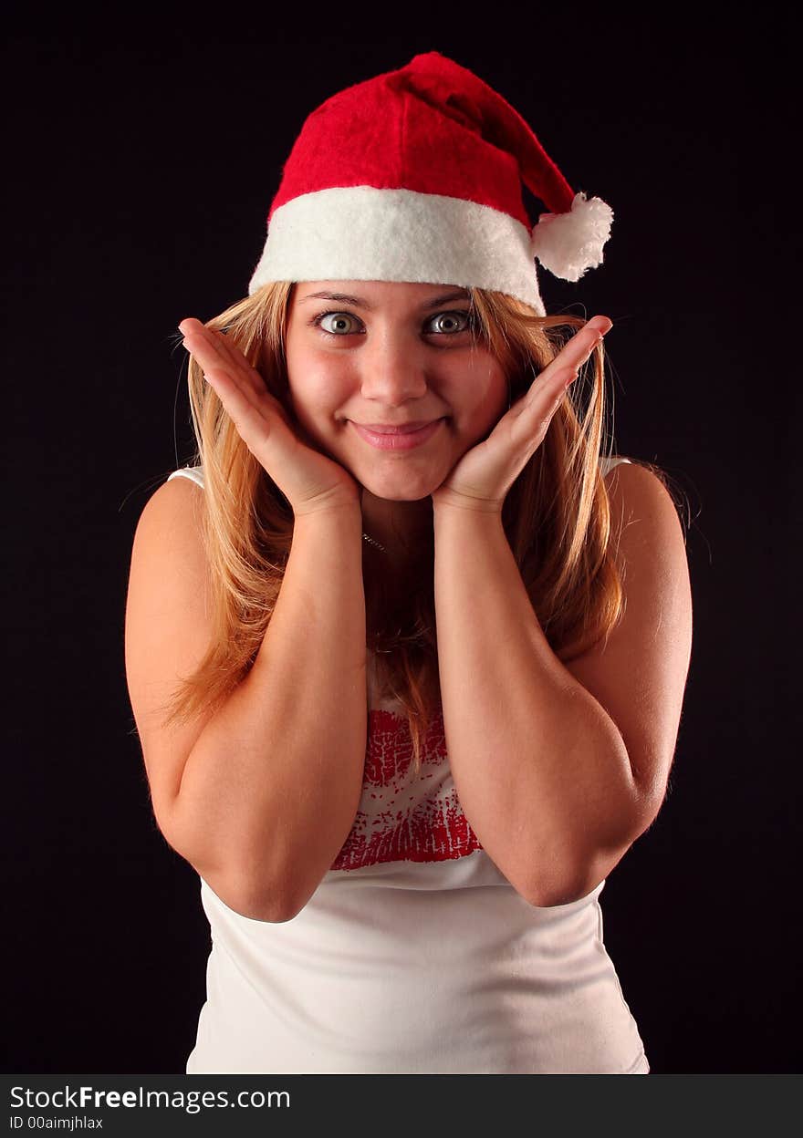 Surprised Christmas blonde girl, black background. Surprised Christmas blonde girl, black background