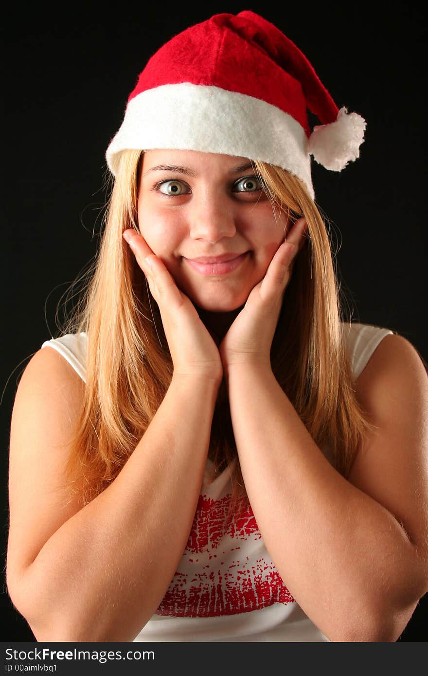 Surprised Christmas blonde girl, black background. Surprised Christmas blonde girl, black background