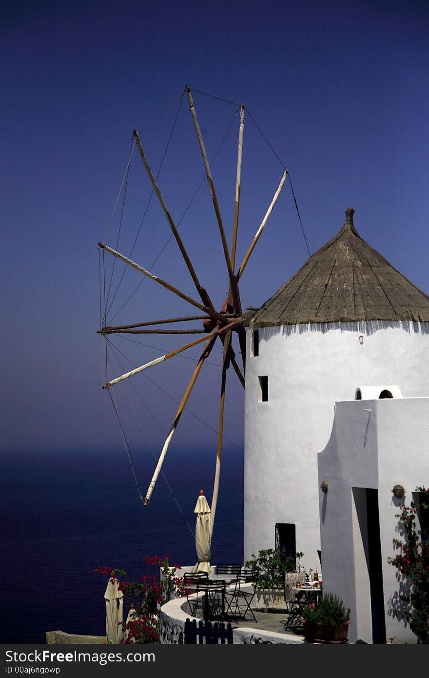 Santorini windmill against the blue sky