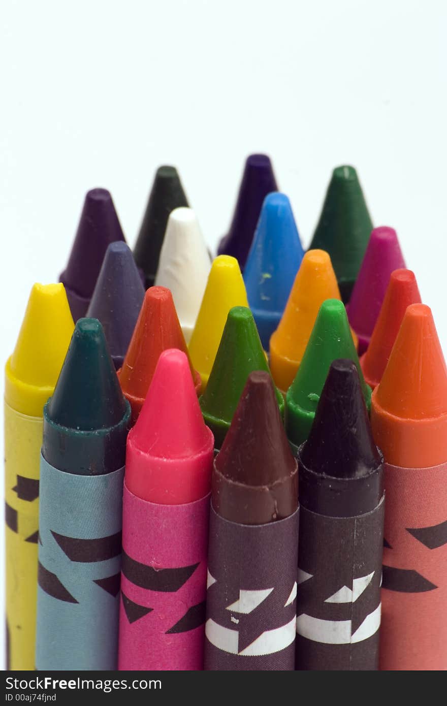 Multi Coloured Crayons set against a plain backgrund.