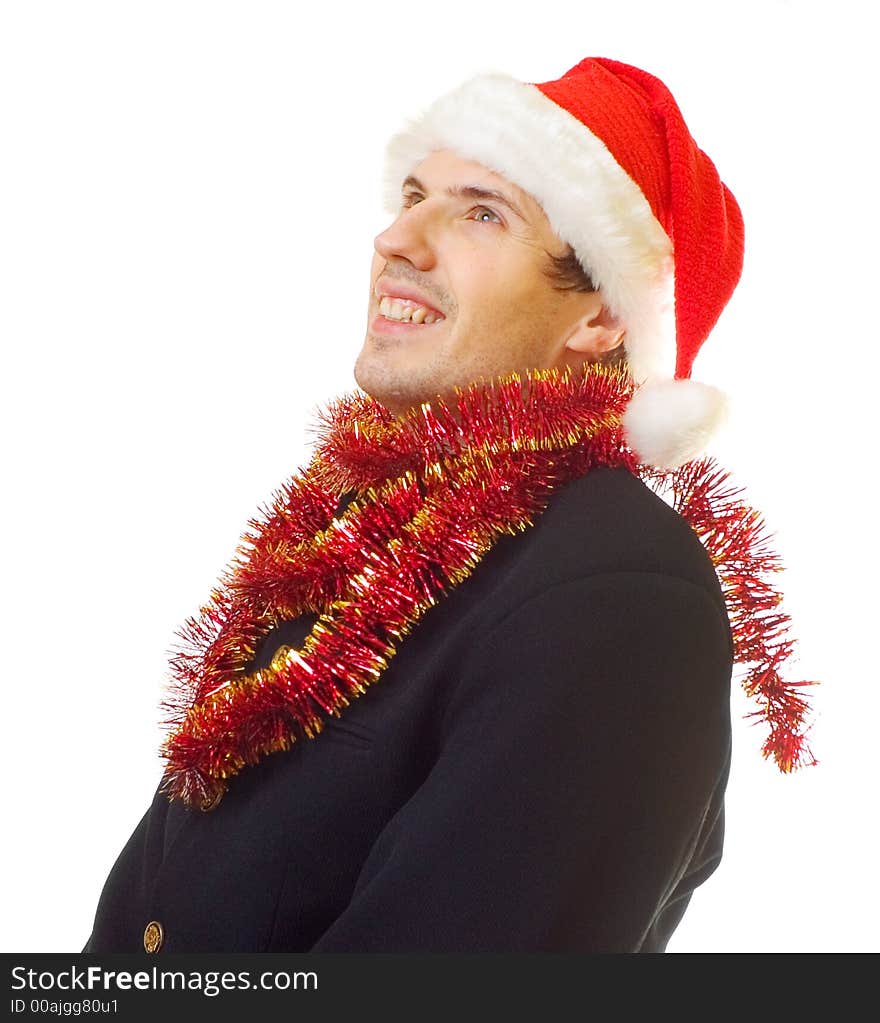 A man dressed in suit, xmas hat and tinsel; over white background. A man dressed in suit, xmas hat and tinsel; over white background