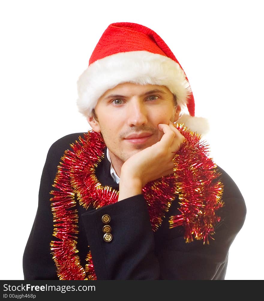 A man dressed in suit, xmas hat and tinsel; over white background. A man dressed in suit, xmas hat and tinsel; over white background