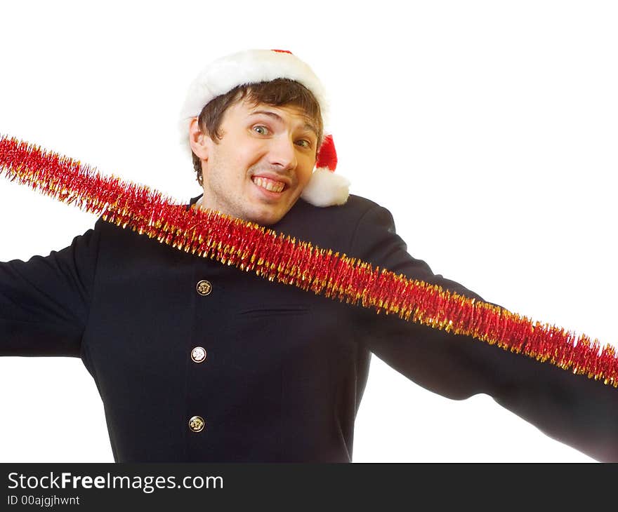 A man dressed in suit, xmas hat stretch the tinsel; over white background. A man dressed in suit, xmas hat stretch the tinsel; over white background