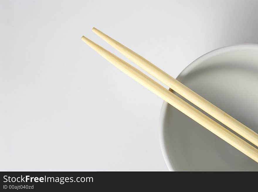 Empty cup witch chinese eating sticks on it. Empty cup witch chinese eating sticks on it