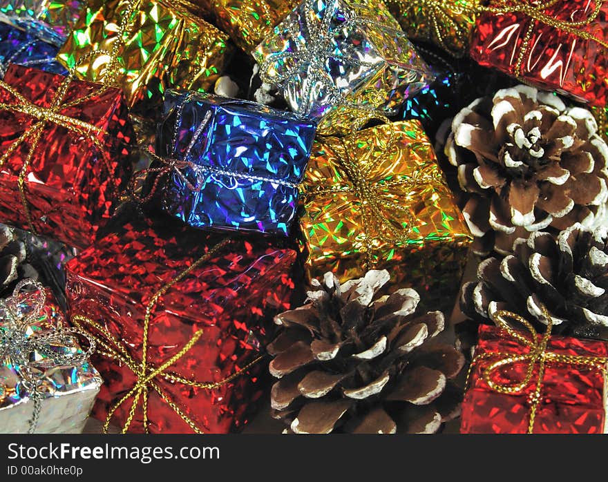 Bright shiney psychedelic Christmas gifts and pinecone decorations.