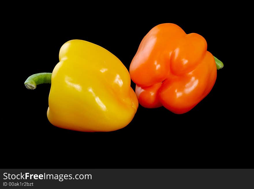 Two sweet peppers on black. Two sweet peppers on black