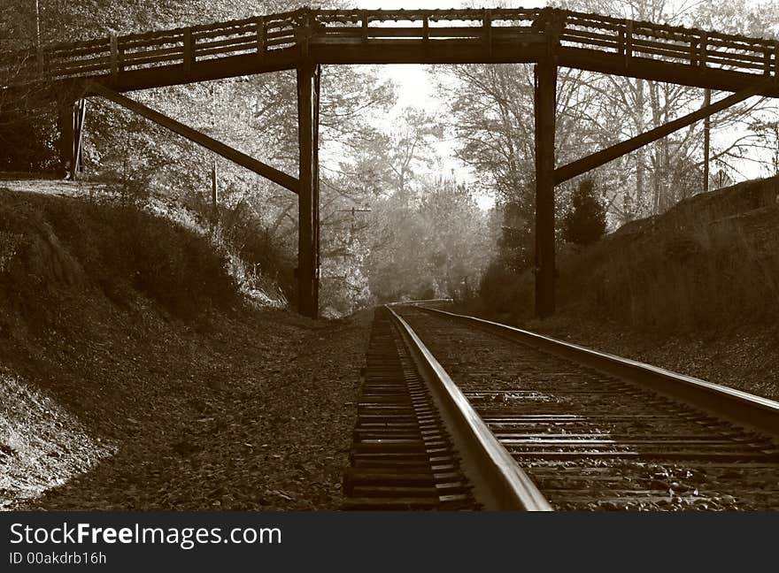 Railroad tracks under the footbridge in old NC town. Railroad tracks under the footbridge in old NC town.