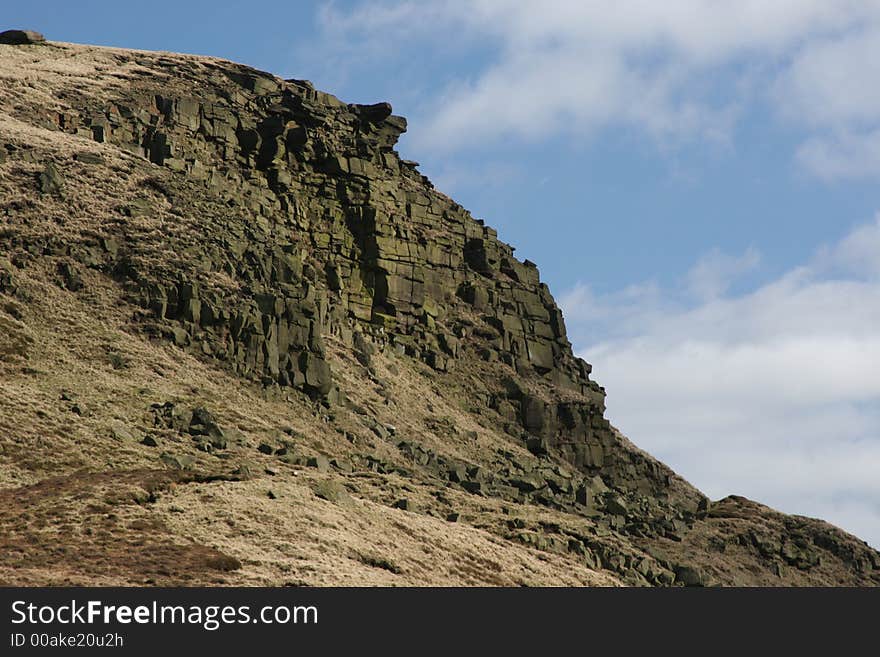 Outcrop of rock on cliff face in Peak District near Sheffield, England. Outcrop of rock on cliff face in Peak District near Sheffield, England