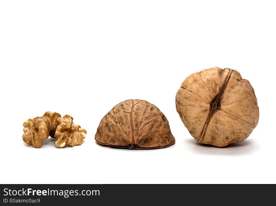 Some brown nuts and a white background