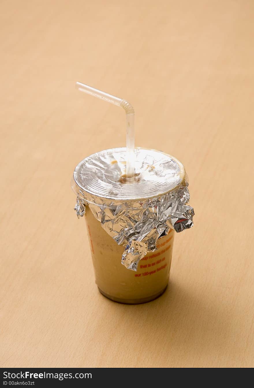 Close up of a Cold Coffee cup with straw