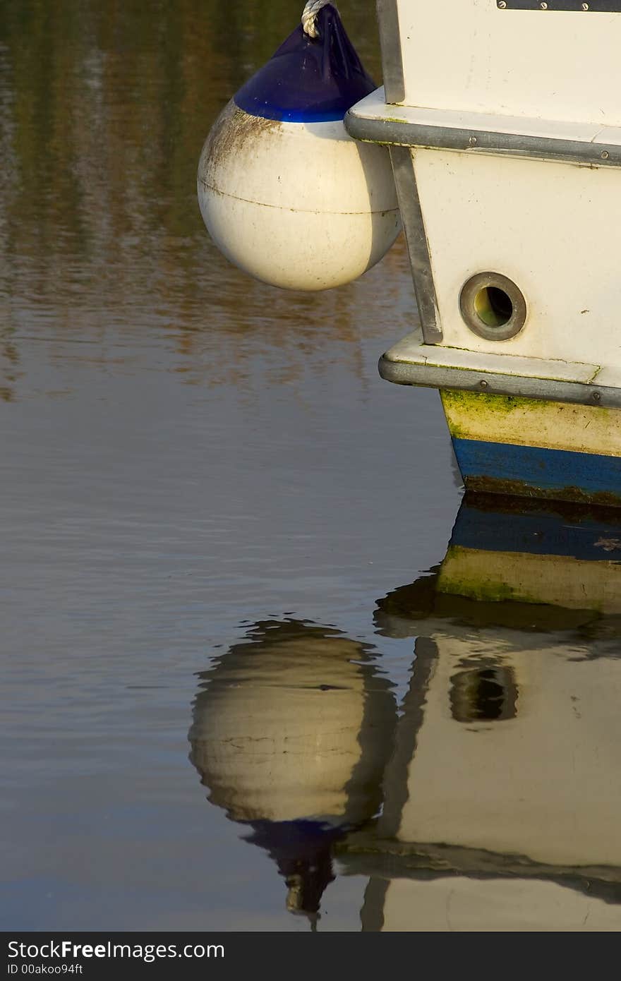 Closeup of the corner of a boat and it's reflection. Closeup of the corner of a boat and it's reflection