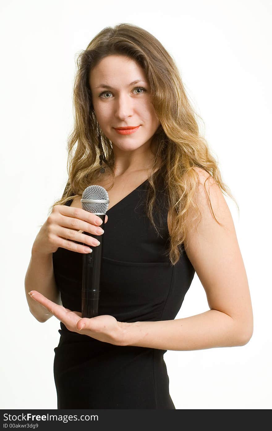 Pretty singer. Woman with microphone on white background.