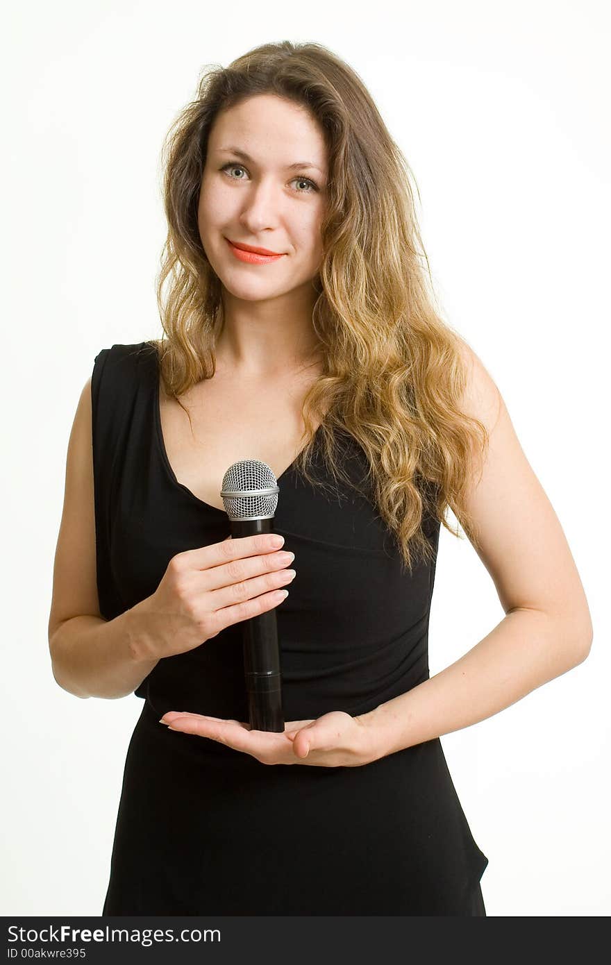 Pretty singer. Woman with microphone on white background.