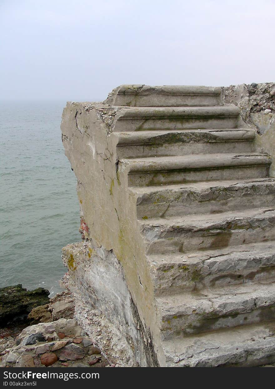 Old cement stairs by the sea in Liepaja (Latvia) - ruins of old forts. Old cement stairs by the sea in Liepaja (Latvia) - ruins of old forts