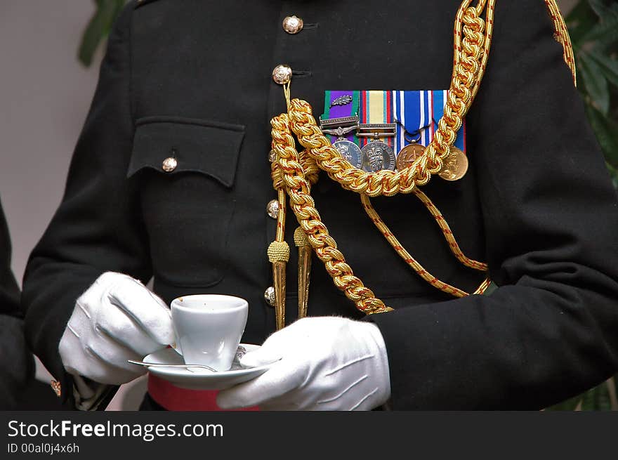 English royal officer standing in conference room at coffey break