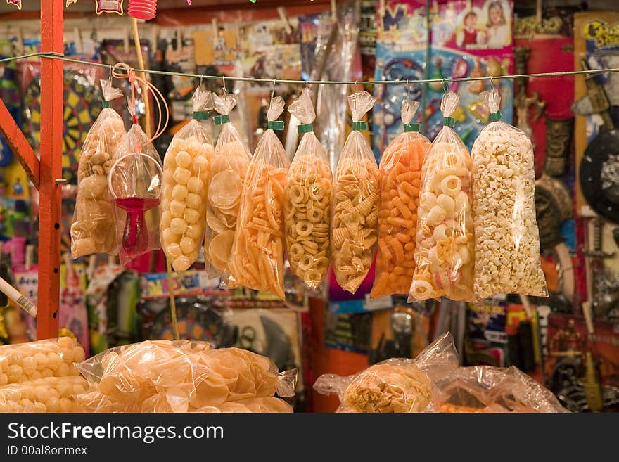 Bags of colorful snacks in a market