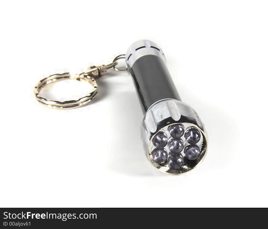 Black and silver flashlight on white background