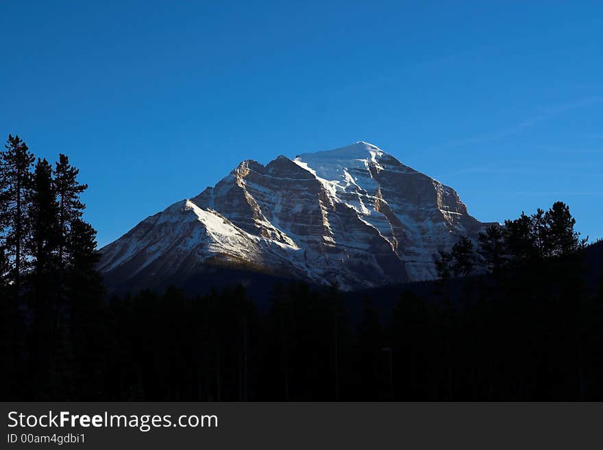 Summit in Banff National Park in Canada, shined by the light of sunset. Summit in Banff National Park in Canada, shined by the light of sunset