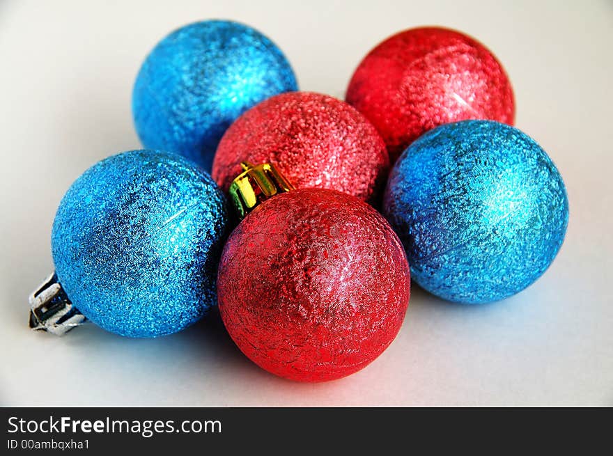 Six red and blue christmas blubs on white background