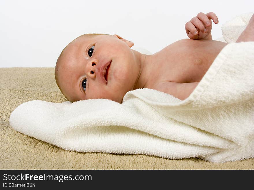 Newborn (3 weeks old) boy in the towel. Newborn (3 weeks old) boy in the towel