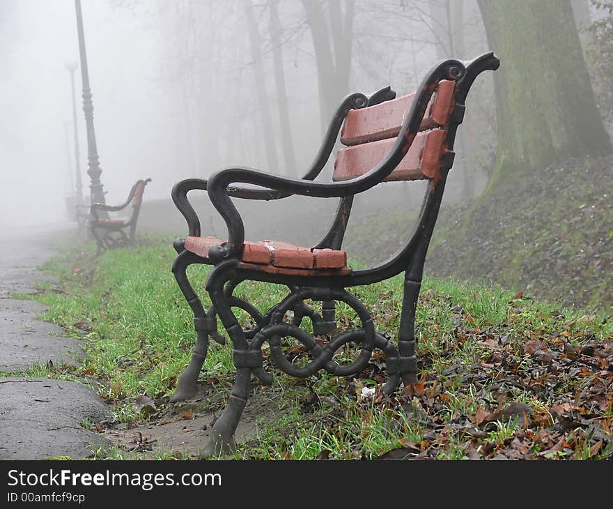 Red bench in the fog. Red bench in the fog