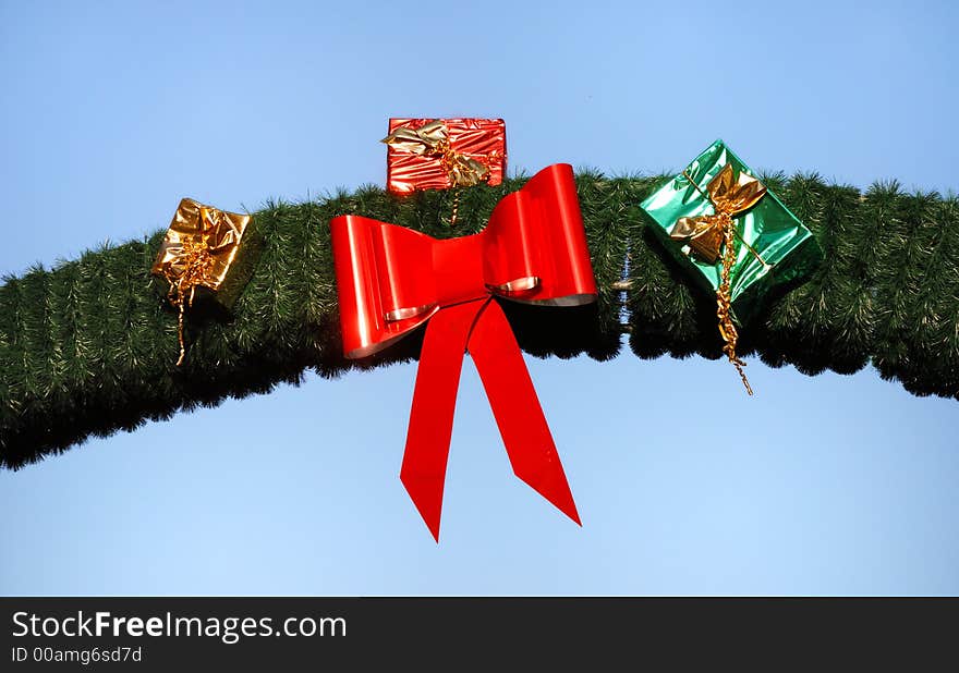 Christmas presents fixed on an arch made of fir branches