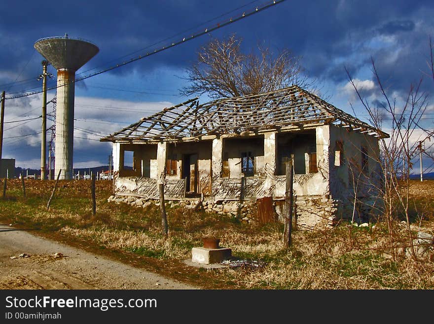 Ruined old house and the tower. Ruined old house and the tower