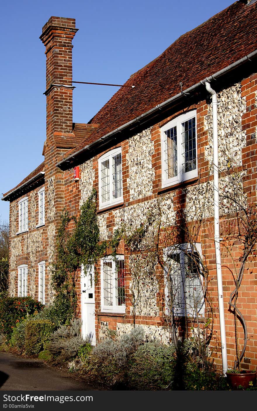 Quaint Row of Brick and Flint Cottages in Rural England. Quaint Row of Brick and Flint Cottages in Rural England