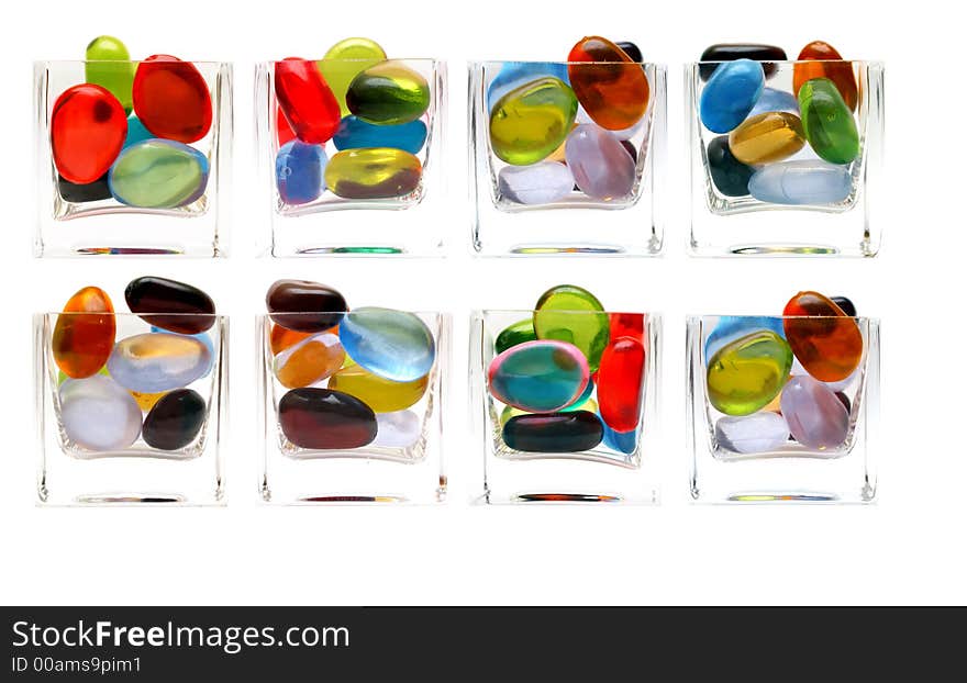 Eight differents glass with colorful pebbled isolated over white