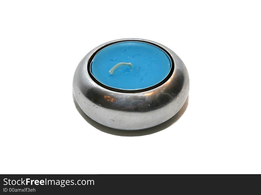 Metal candle holder with blue candle inside