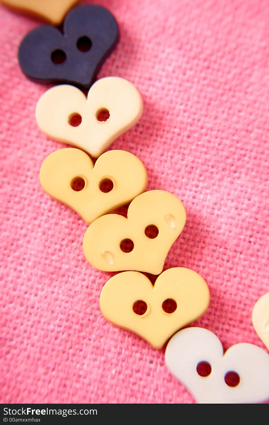 A line of buttons for Valentine's Day.  It seems like around Valentine's Day everything is shaped like hearts. A line of buttons for Valentine's Day.  It seems like around Valentine's Day everything is shaped like hearts.