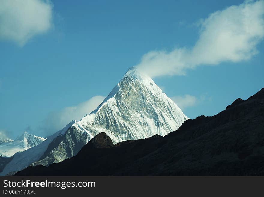 Peak Caraz and white cloud in Cordilleras mountain. Peak Caraz and white cloud in Cordilleras mountain