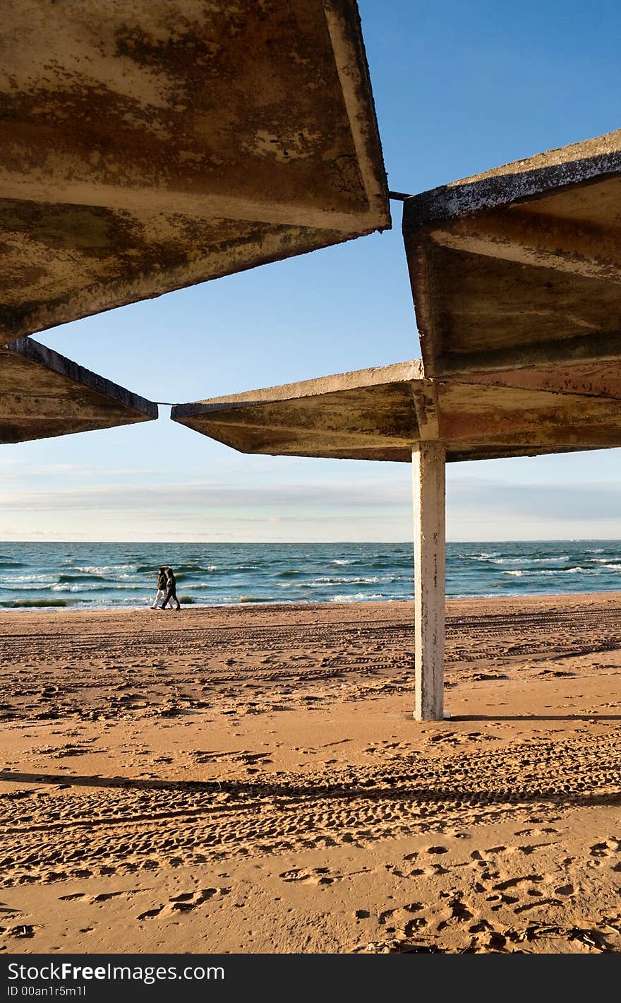 Concrete tent on a background of winter beach. Concrete tent on a background of winter beach